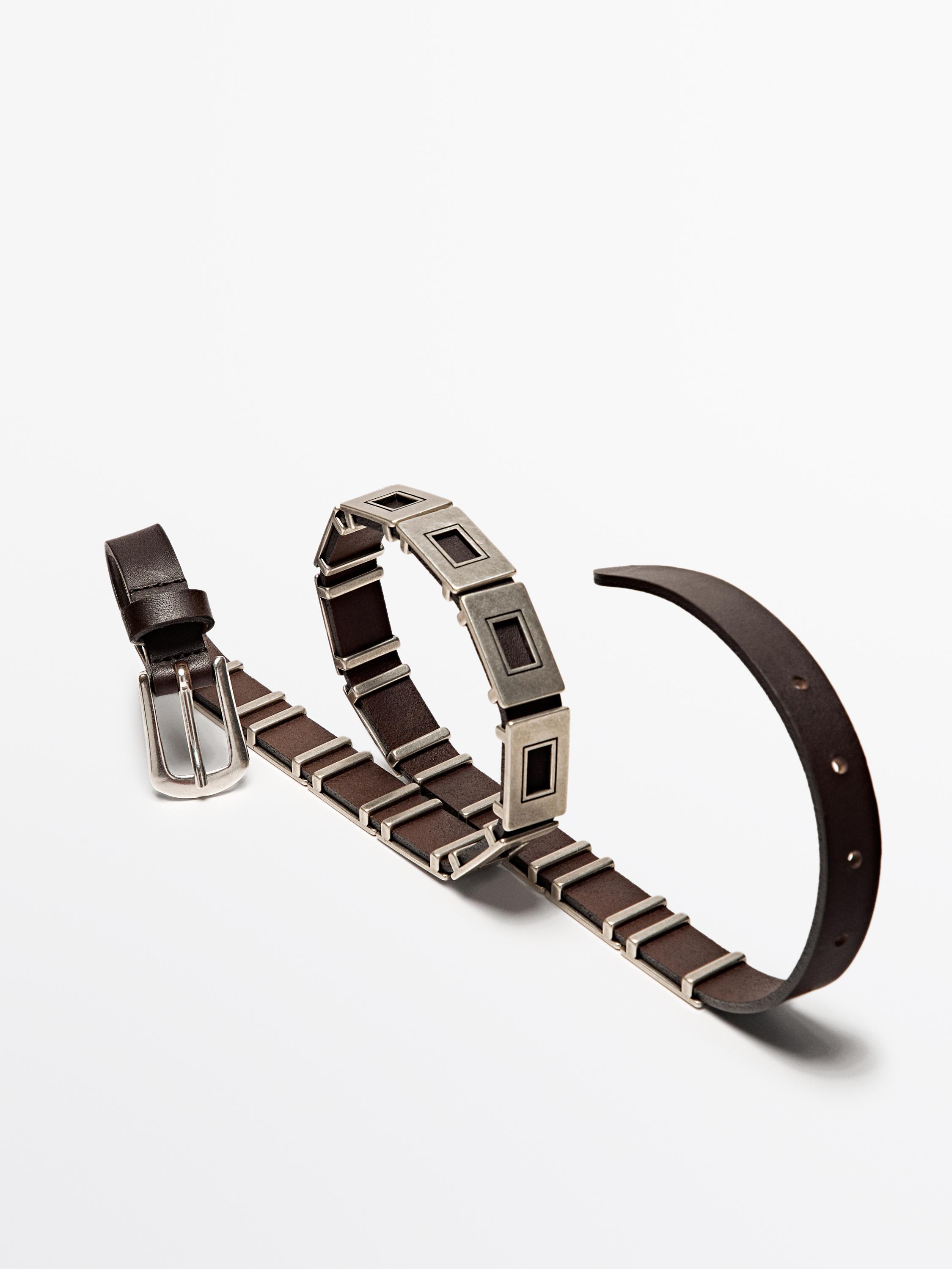 Belt with metal appliqués